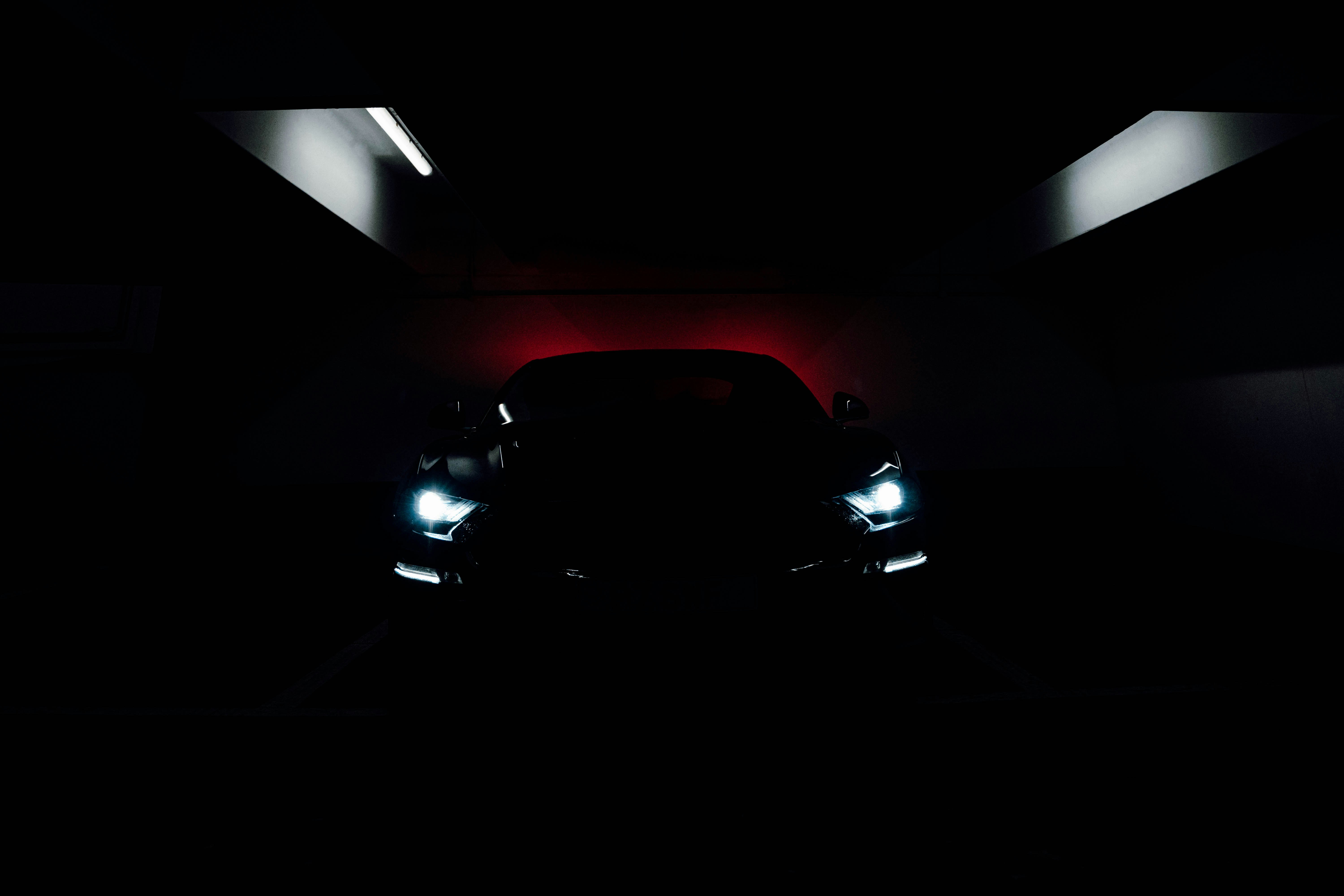 black car in a dark room
