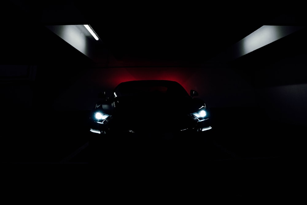 black car in a dark room