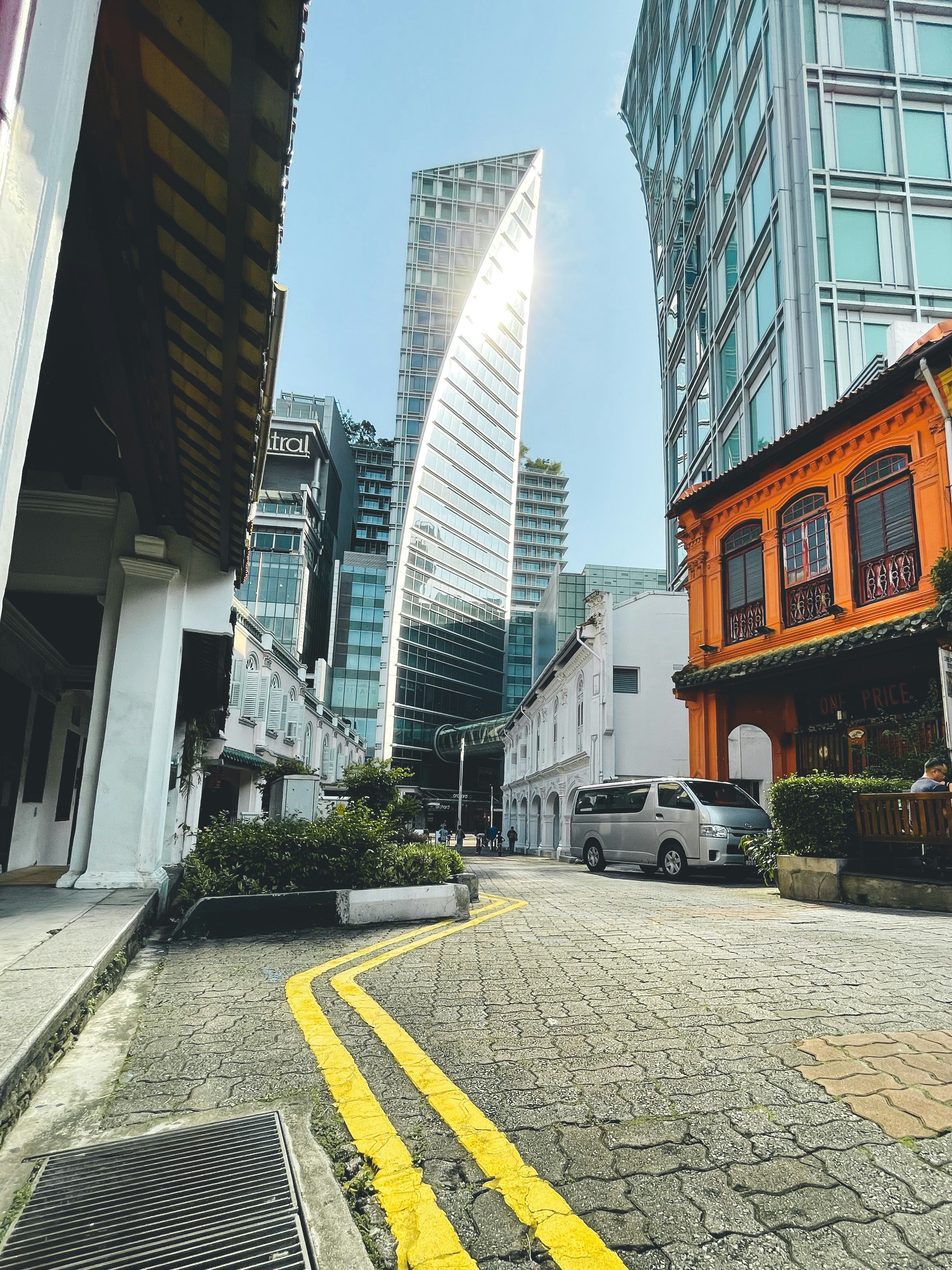 white car parked beside building during daytime