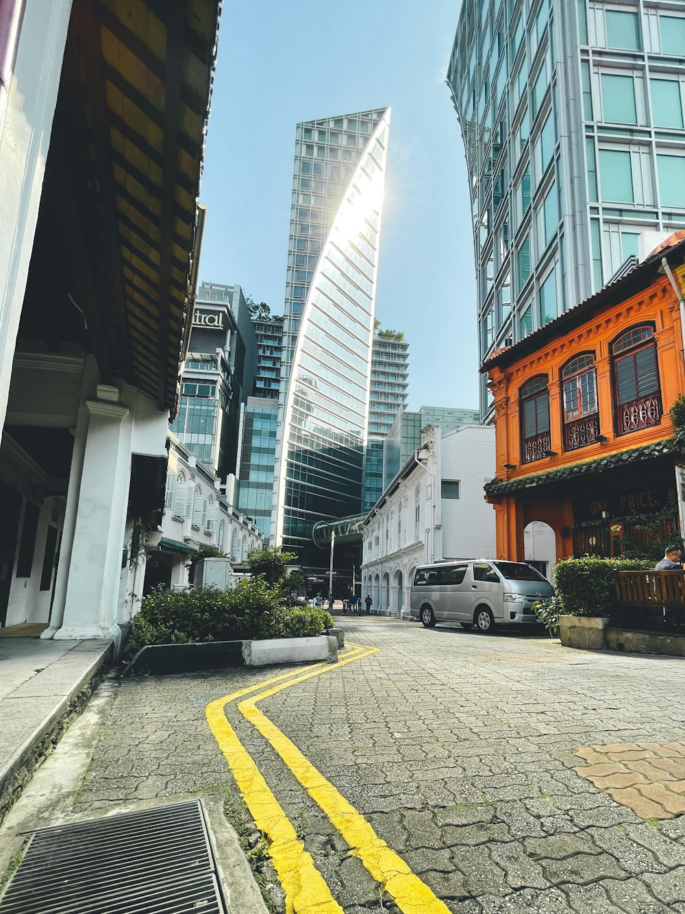 white car parked beside building during daytime