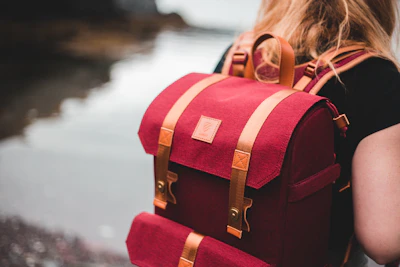 woman in red and white backpack