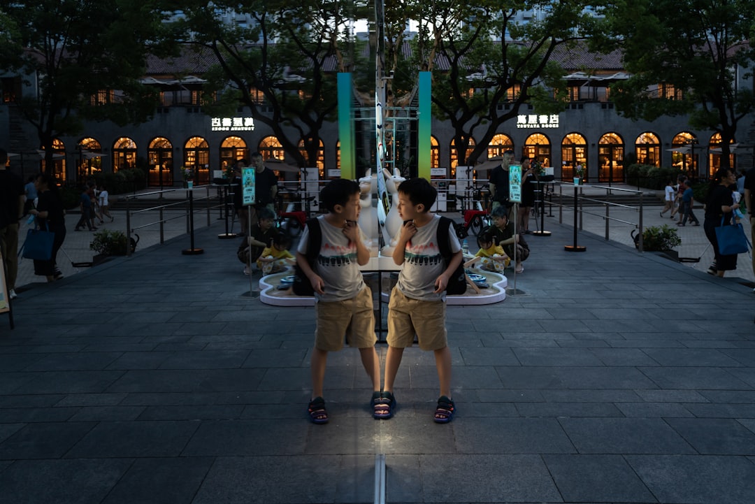 man and woman sitting on bench during night time