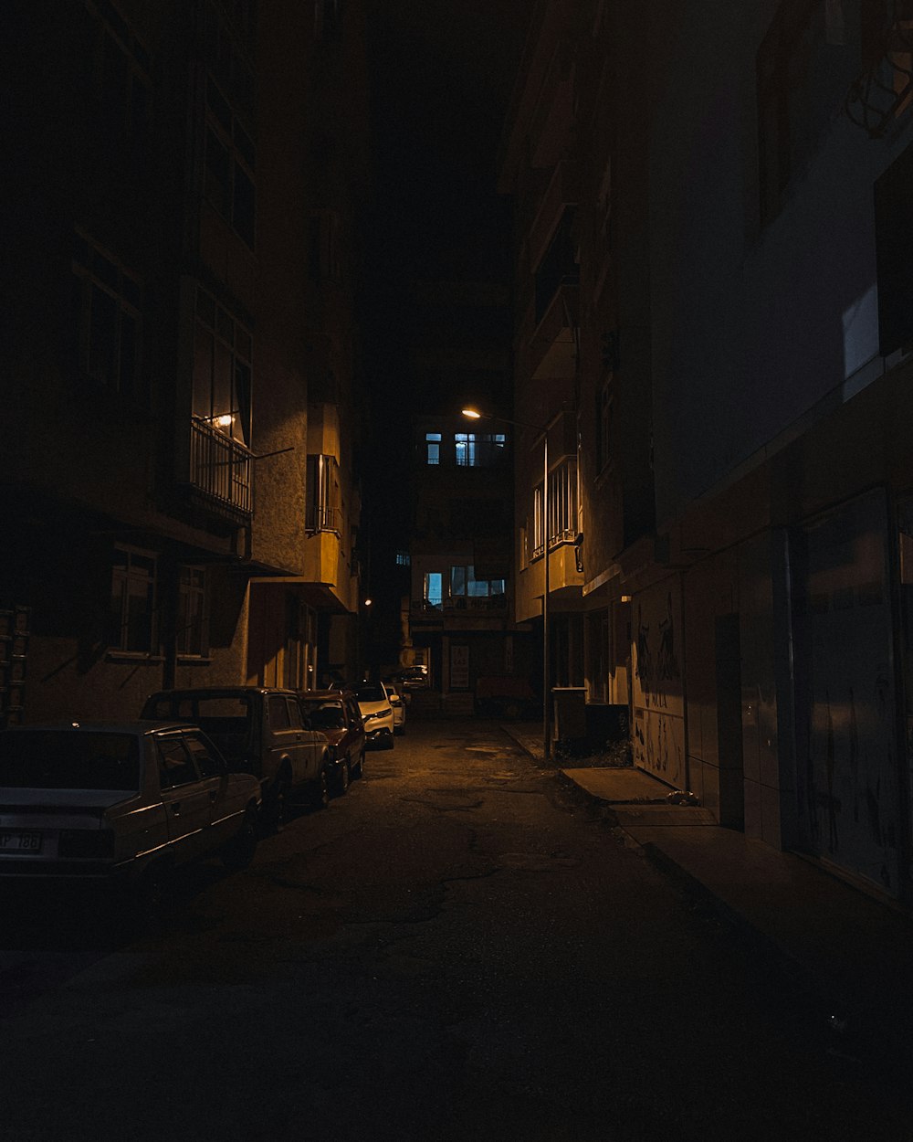 cars parked on side of the road during night time