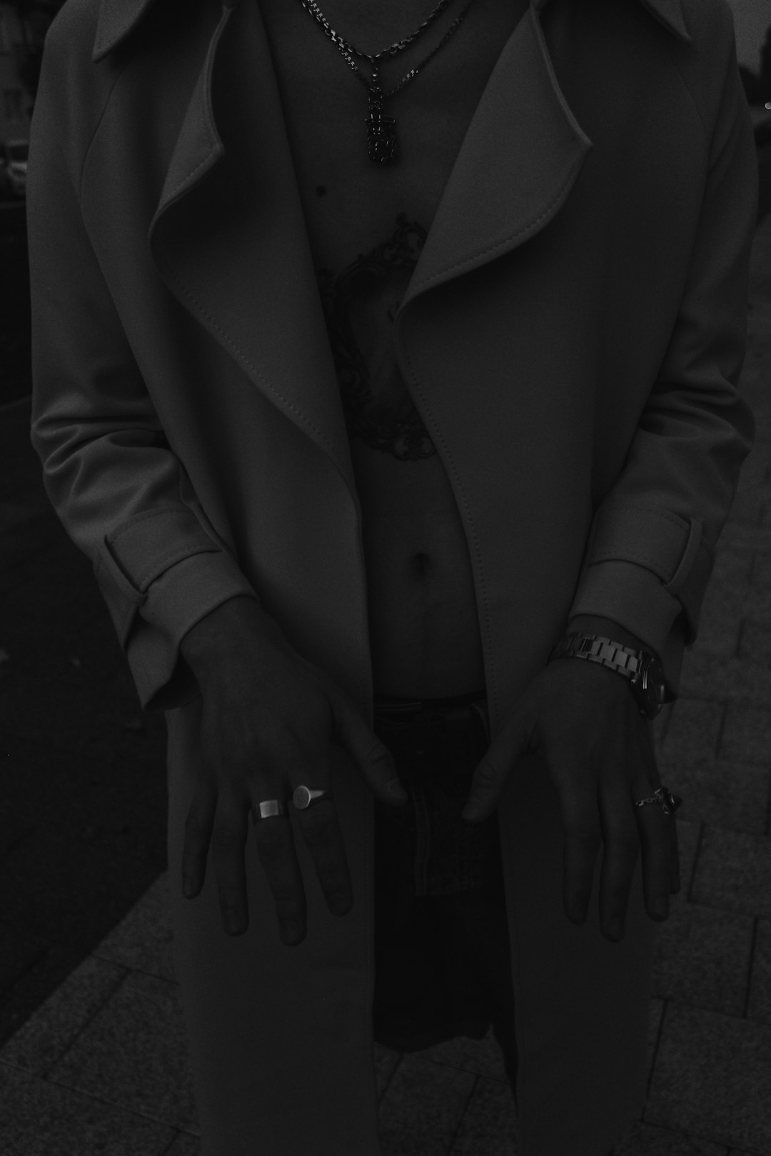 person in gray coat wearing black watch