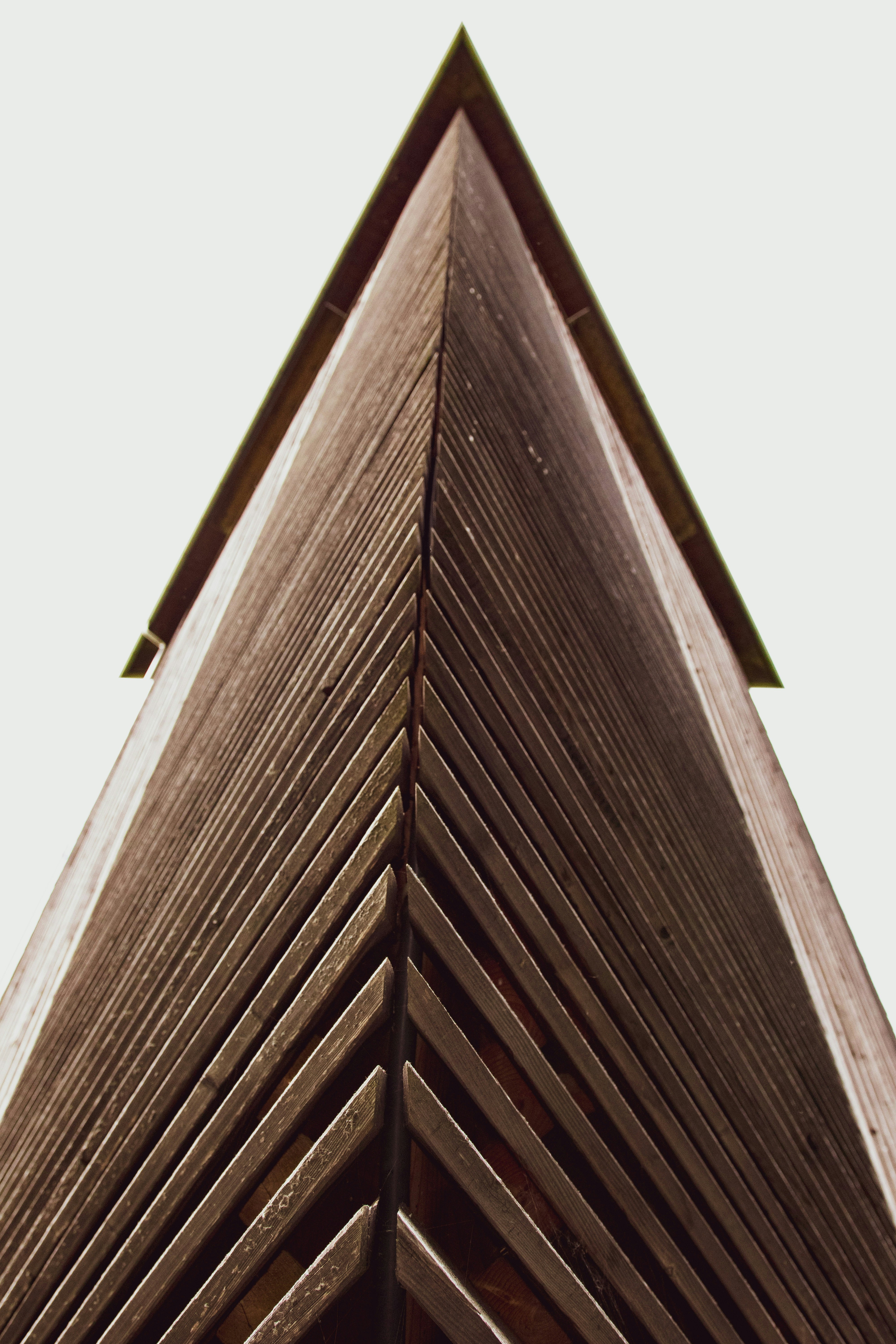 brown wooden stairs under white sky during daytime