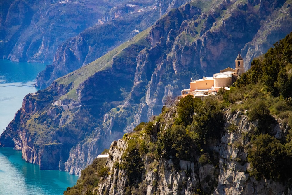 white concrete building on top of mountain during daytime