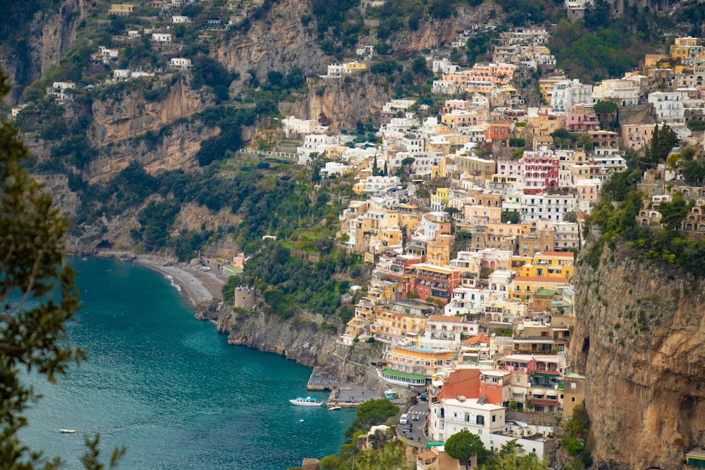 aerial view of city buildings near body of water during daytime