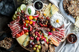 sliced fruits on brown wooden bowl