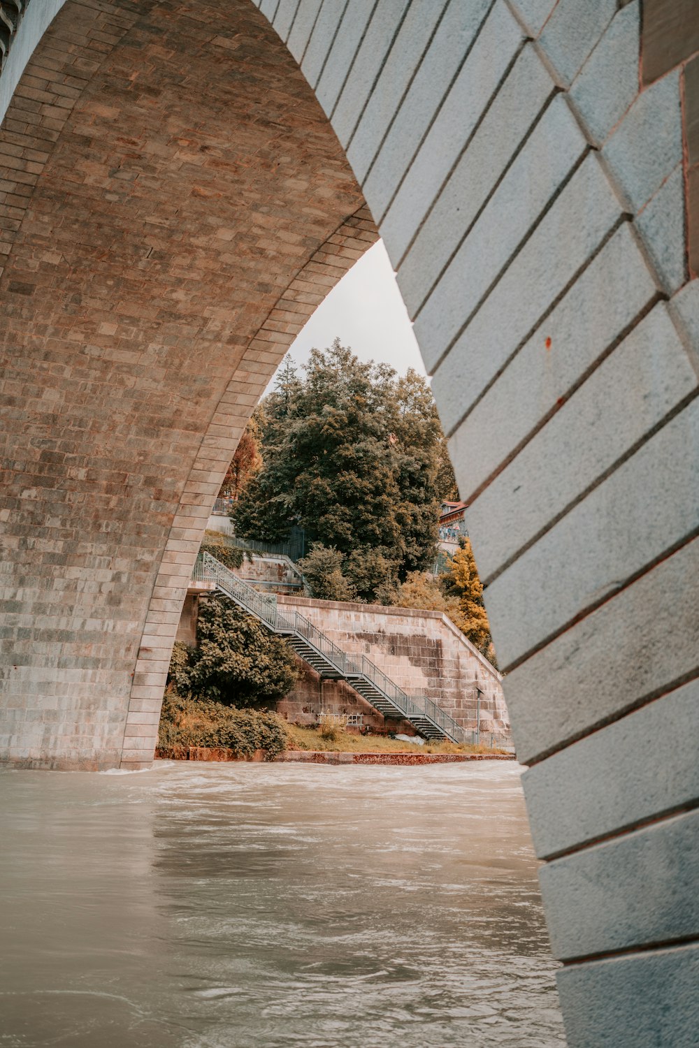 brown concrete bridge over river