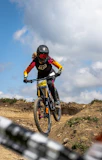 man in black helmet riding on mountain bike