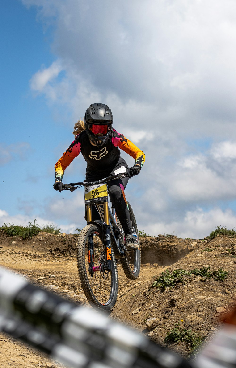 man in black helmet riding on mountain bike