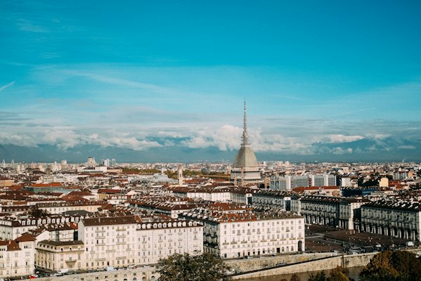 White and brown concrete building under blue sky during daytime — Turin, Italy