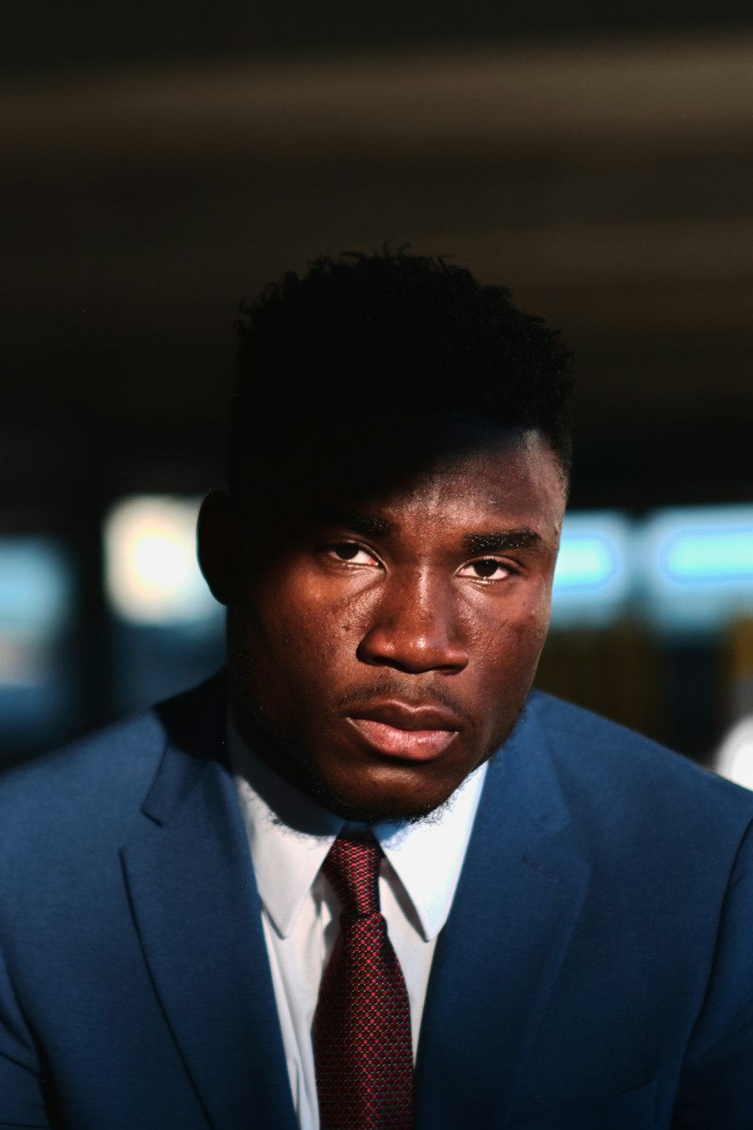 man in blue suit jacket