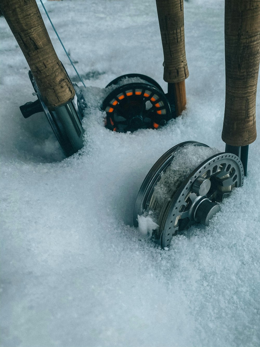 black and brown metal tool on snow