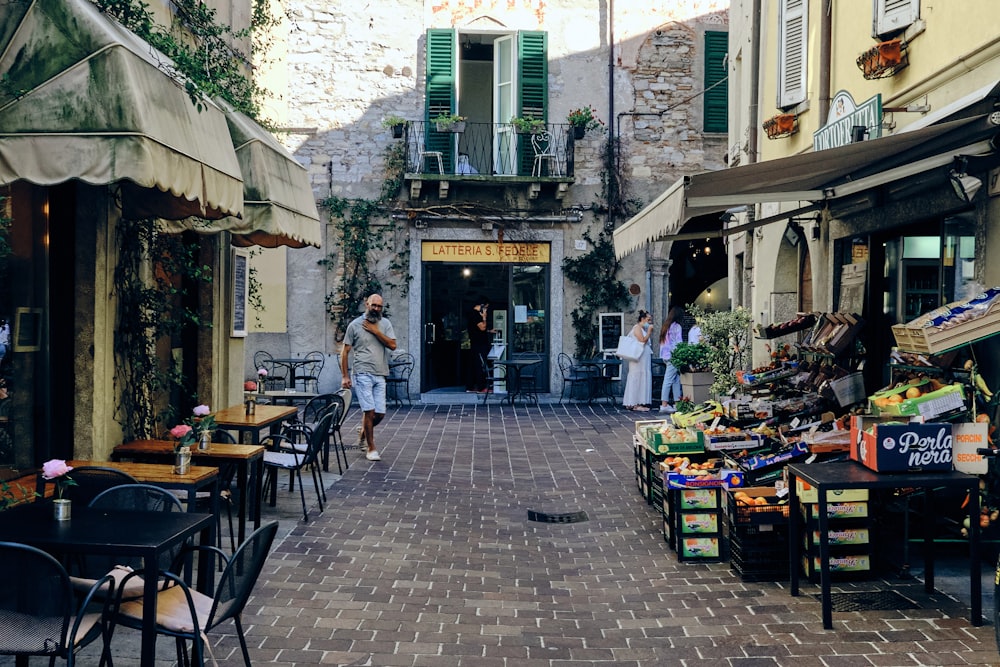 people sitting on chairs outside restaurant during daytime