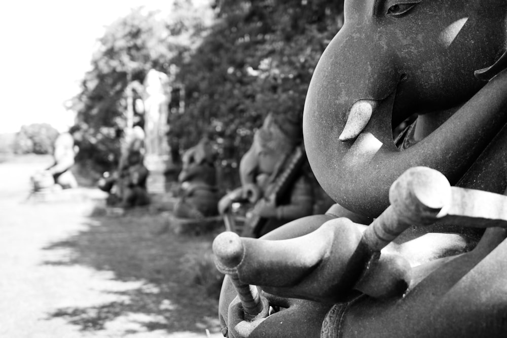 grayscale photo of human face statue