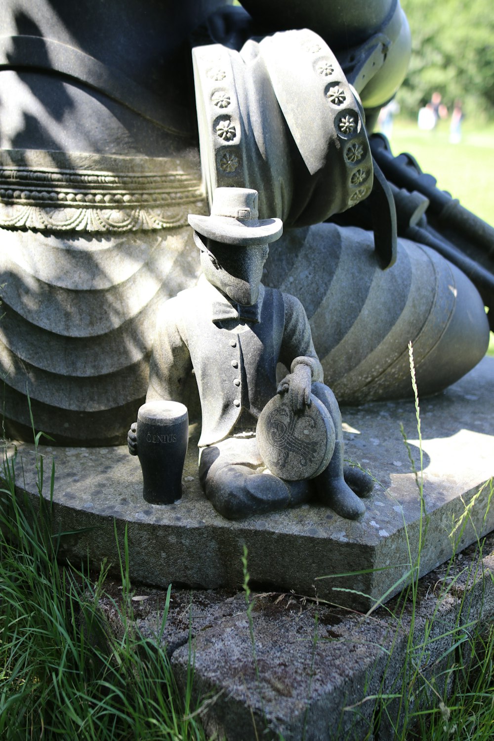 gray concrete statue on gray concrete blocks