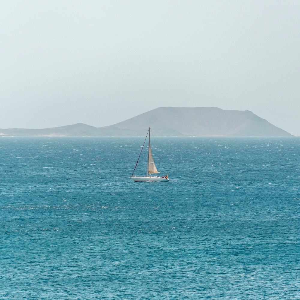 white sailboat on sea during daytime