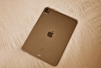 silver ipad on white textile