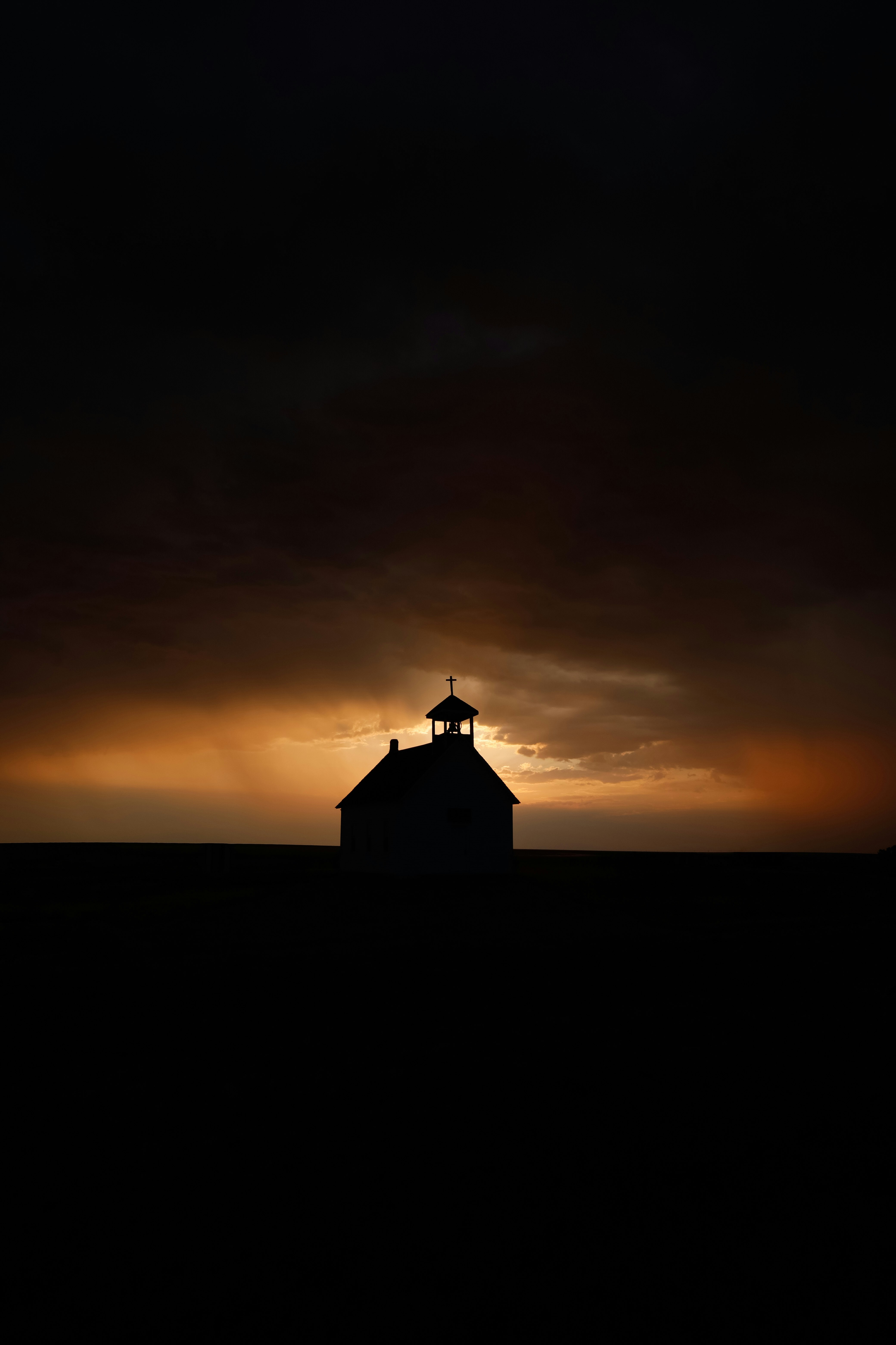 silhouette of building during sunset