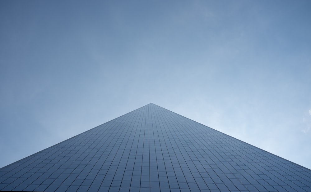 a very tall building with a sky background