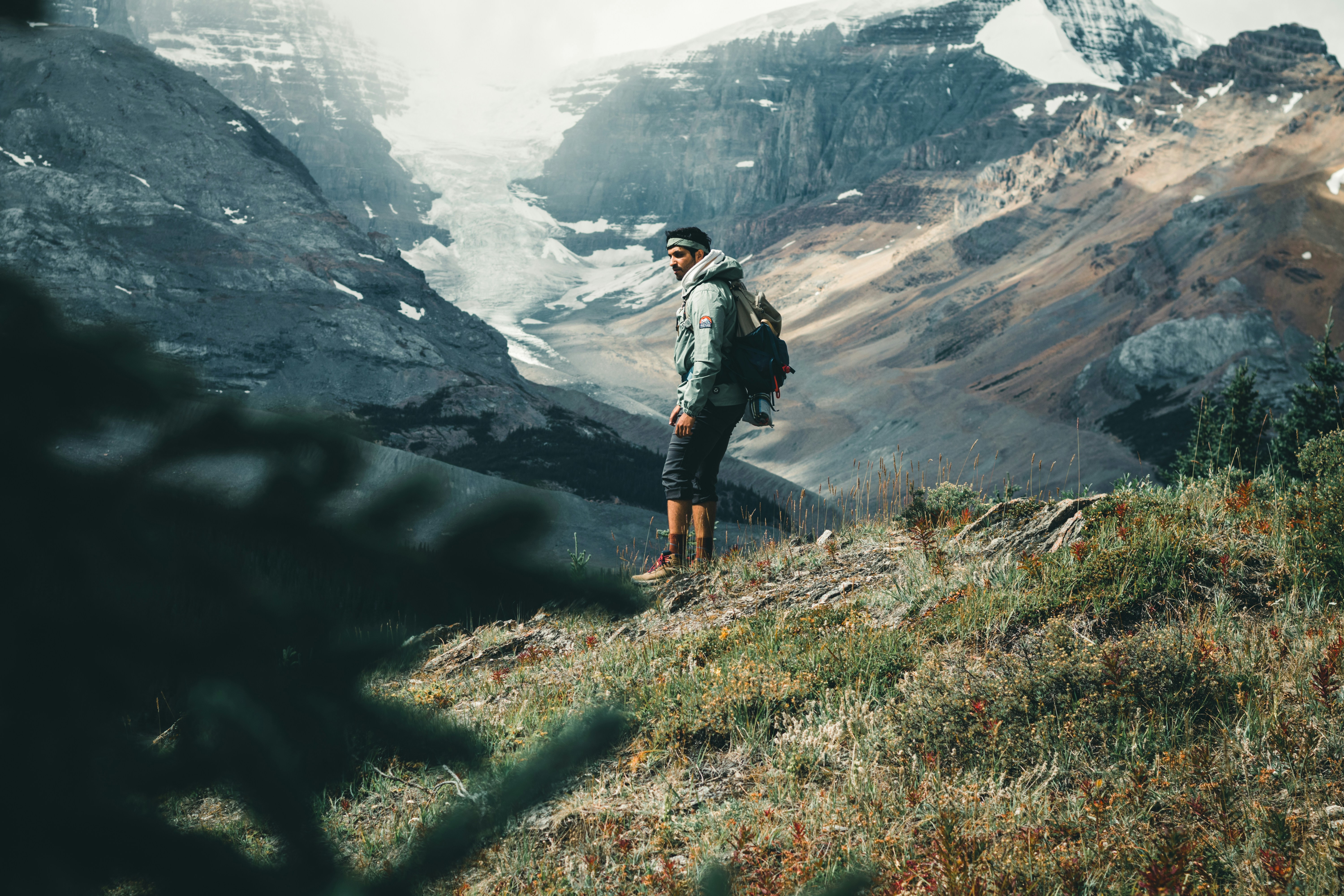 woman in black jacket and black pants standing on green grass field during daytime, Jasper National Park is my favourite place in the Canadian Rockies