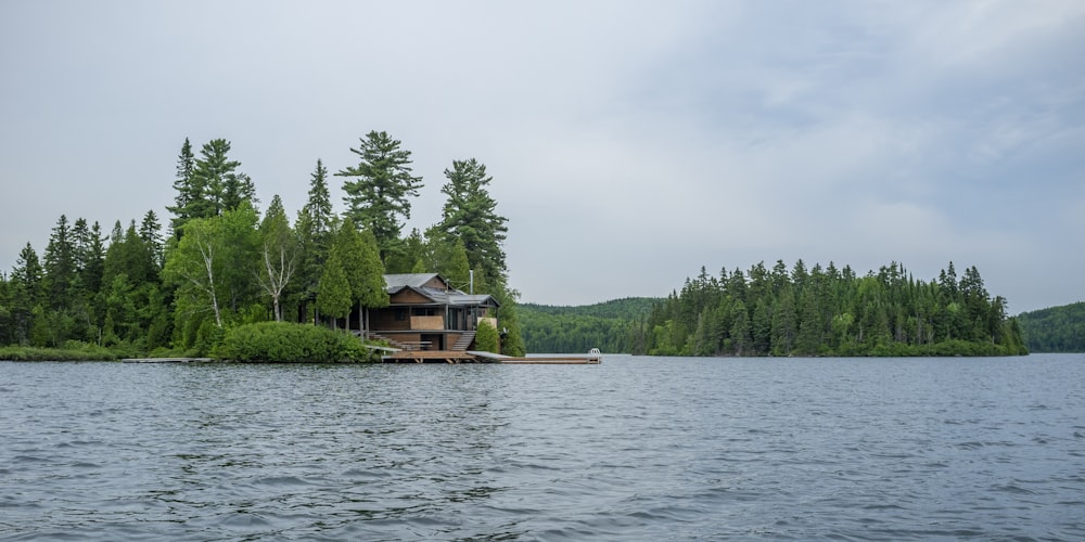 a house on a small island in the middle of a lake