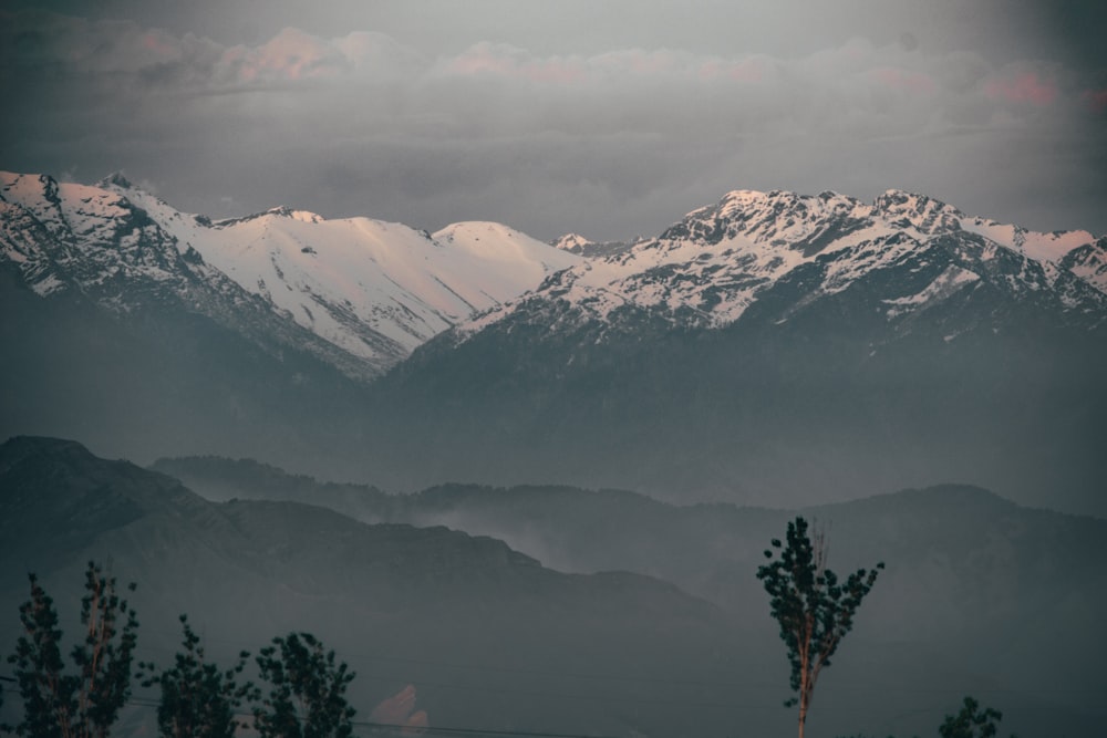 a view of a mountain range covered in snow