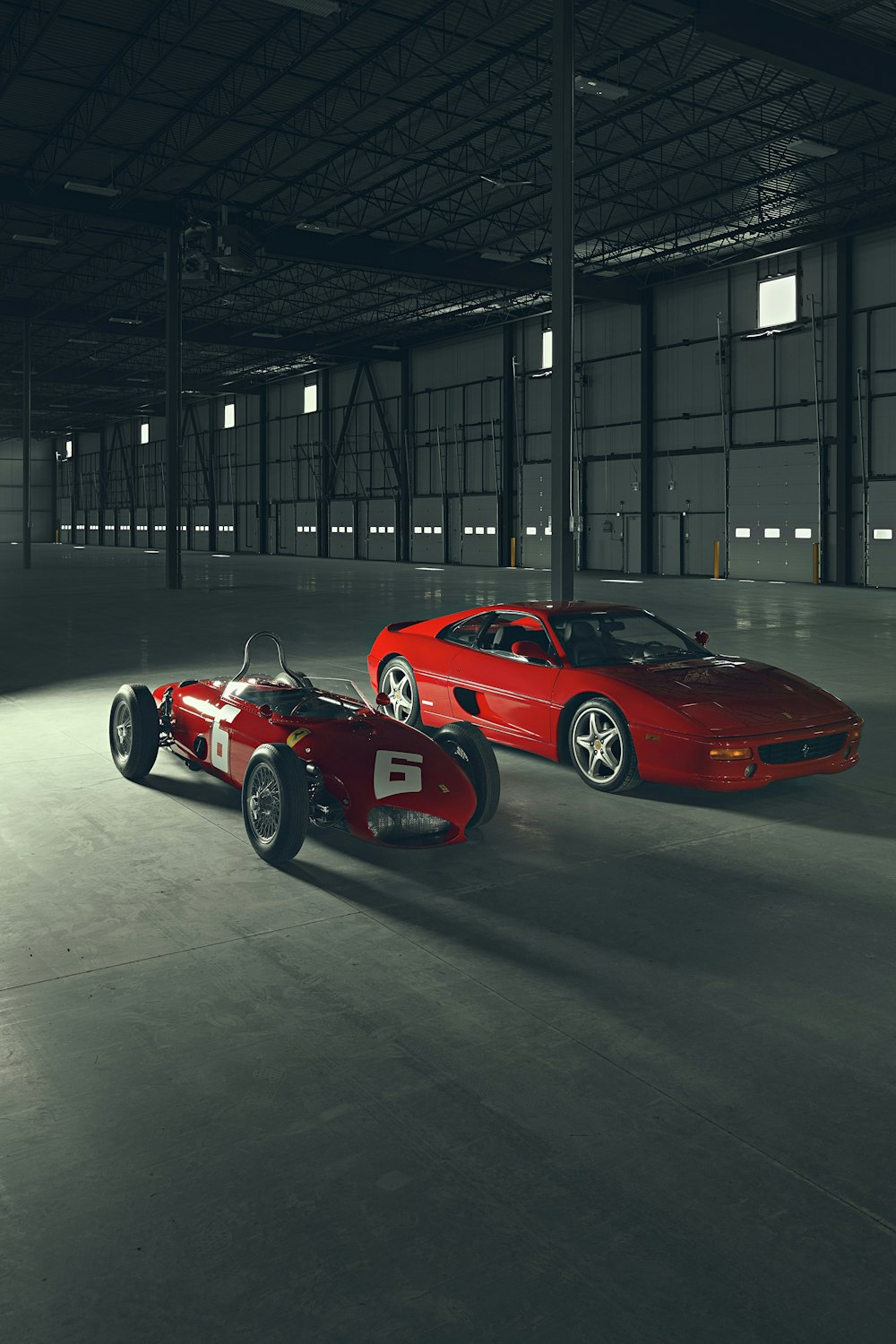 red ferrari 458 italia parked in building