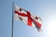 red and white flag on pole
