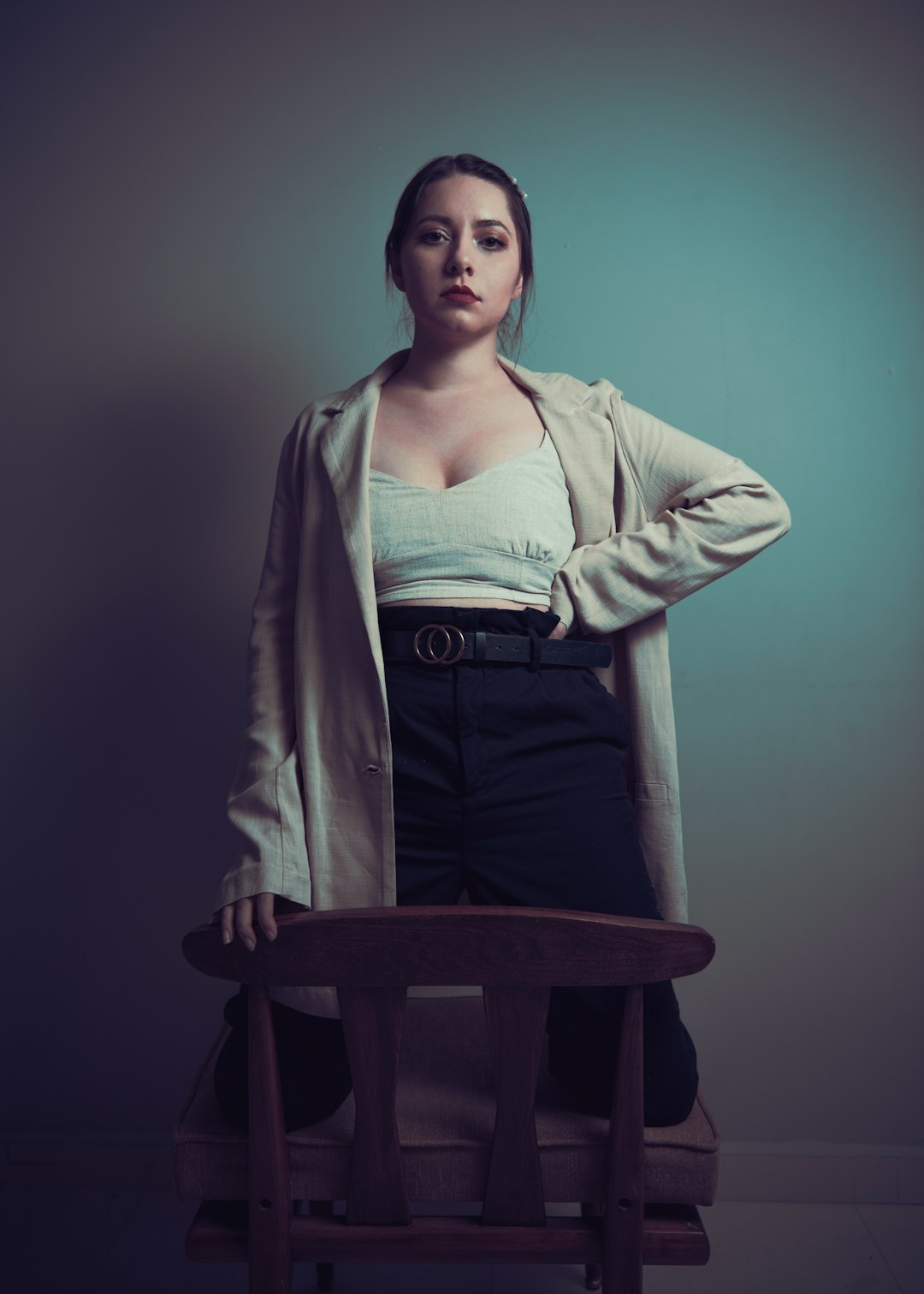 woman in white cardigan sitting on chair