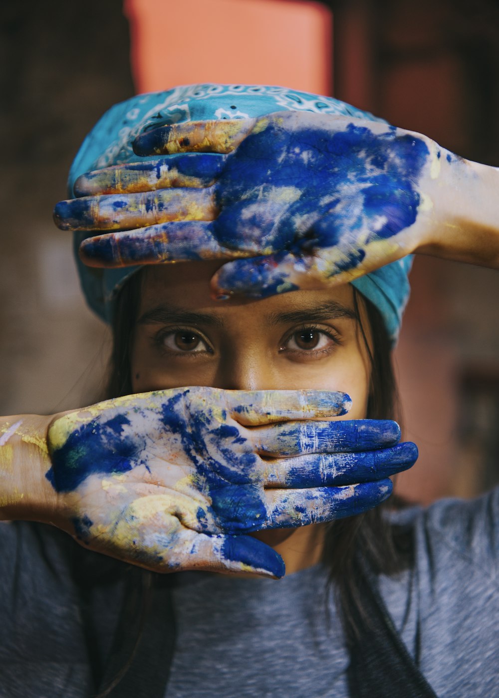 person with blue paint on face