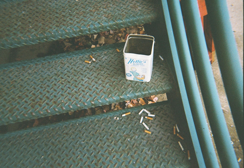 white and blue plastic container