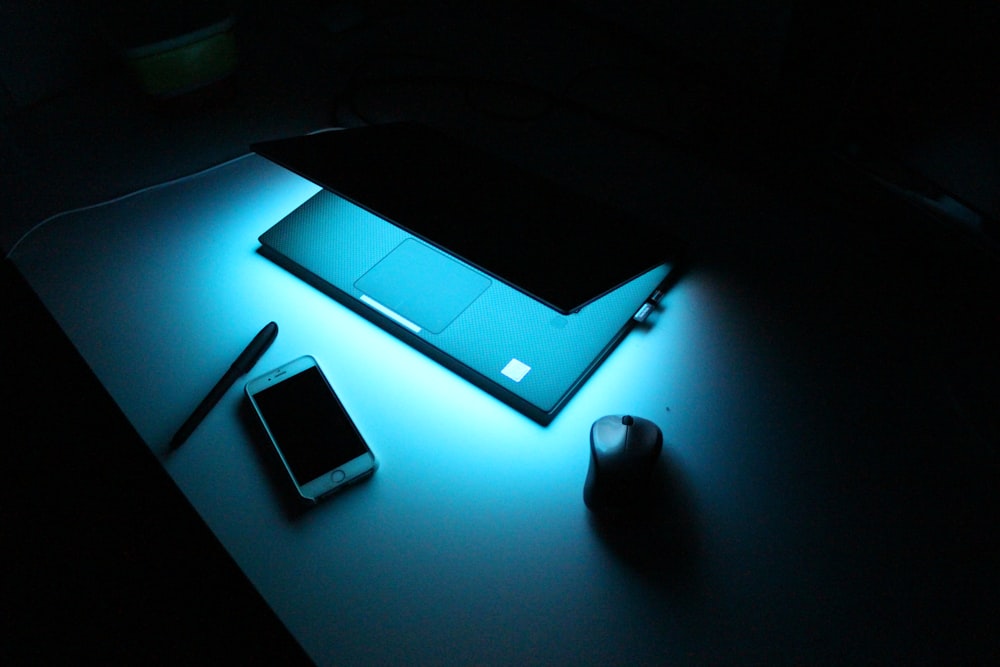 white smartphone on white table