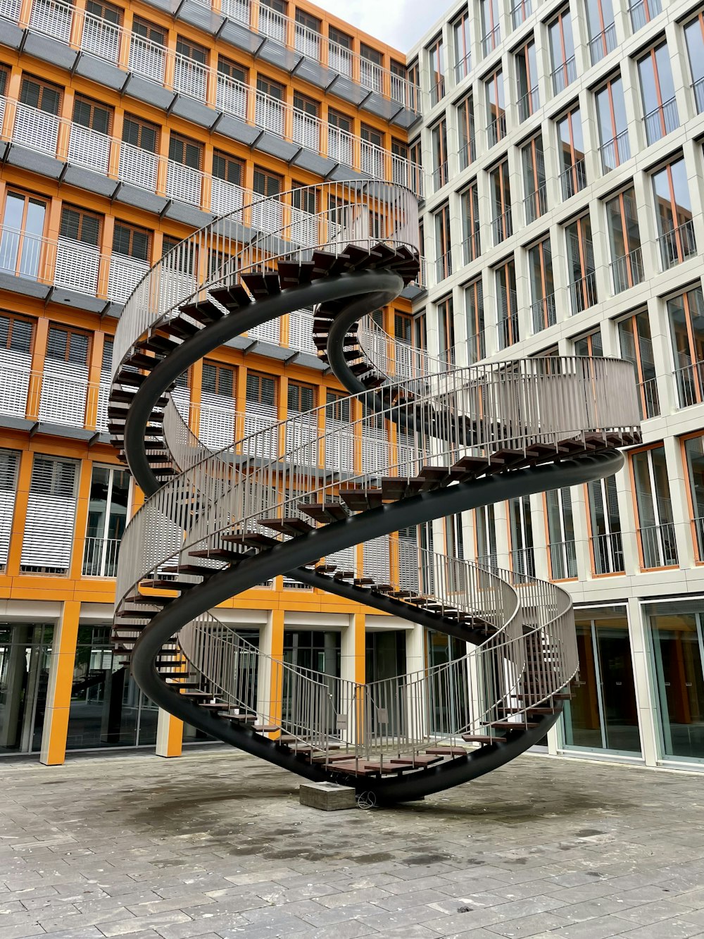yellow spiral staircase in building
