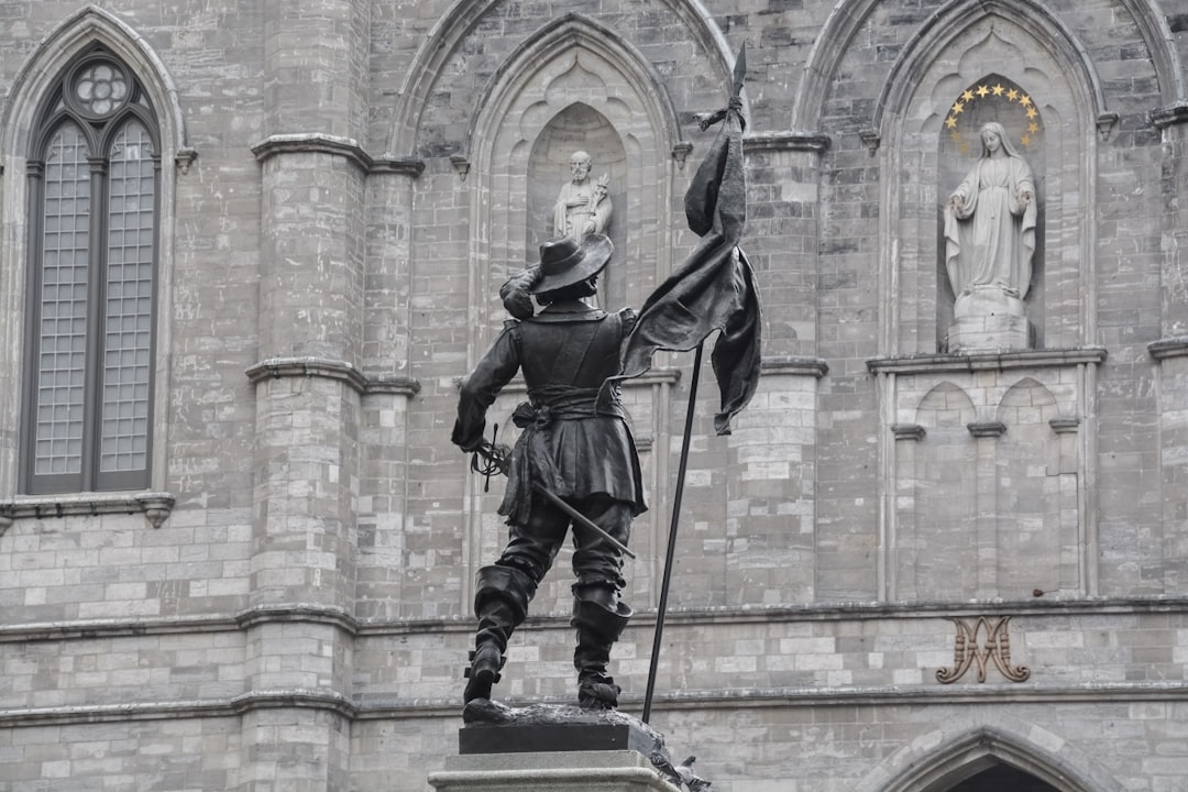 man holding a sword statue