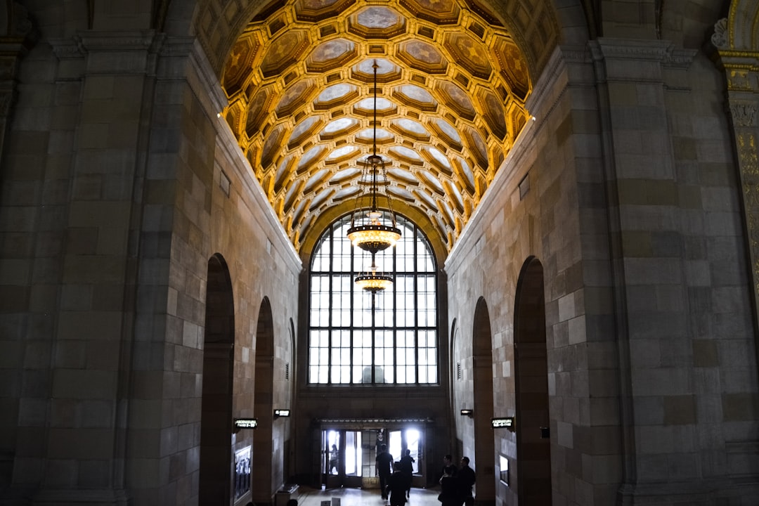 people inside brown and white building