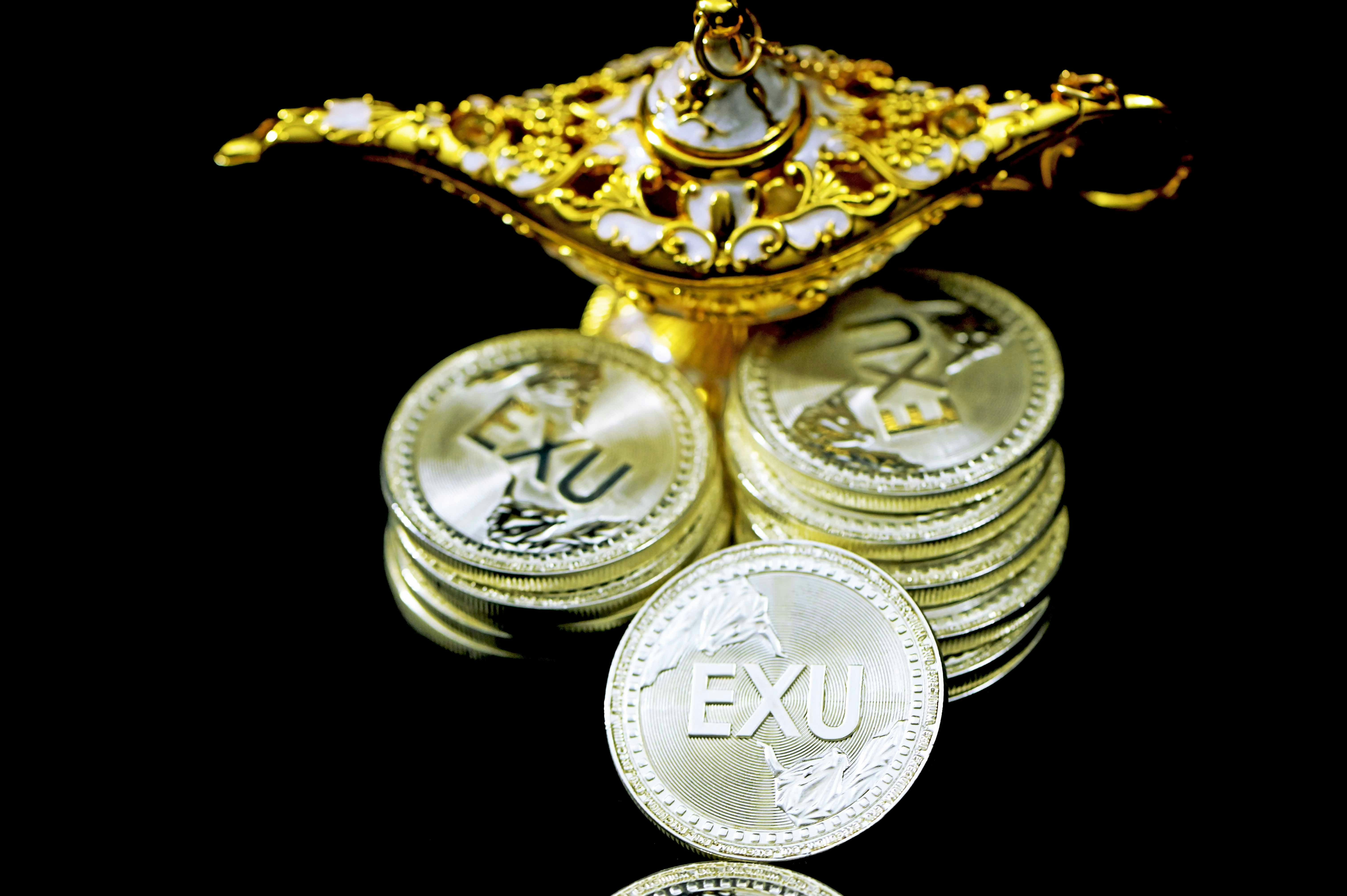 Executium coins under a magic lamp
