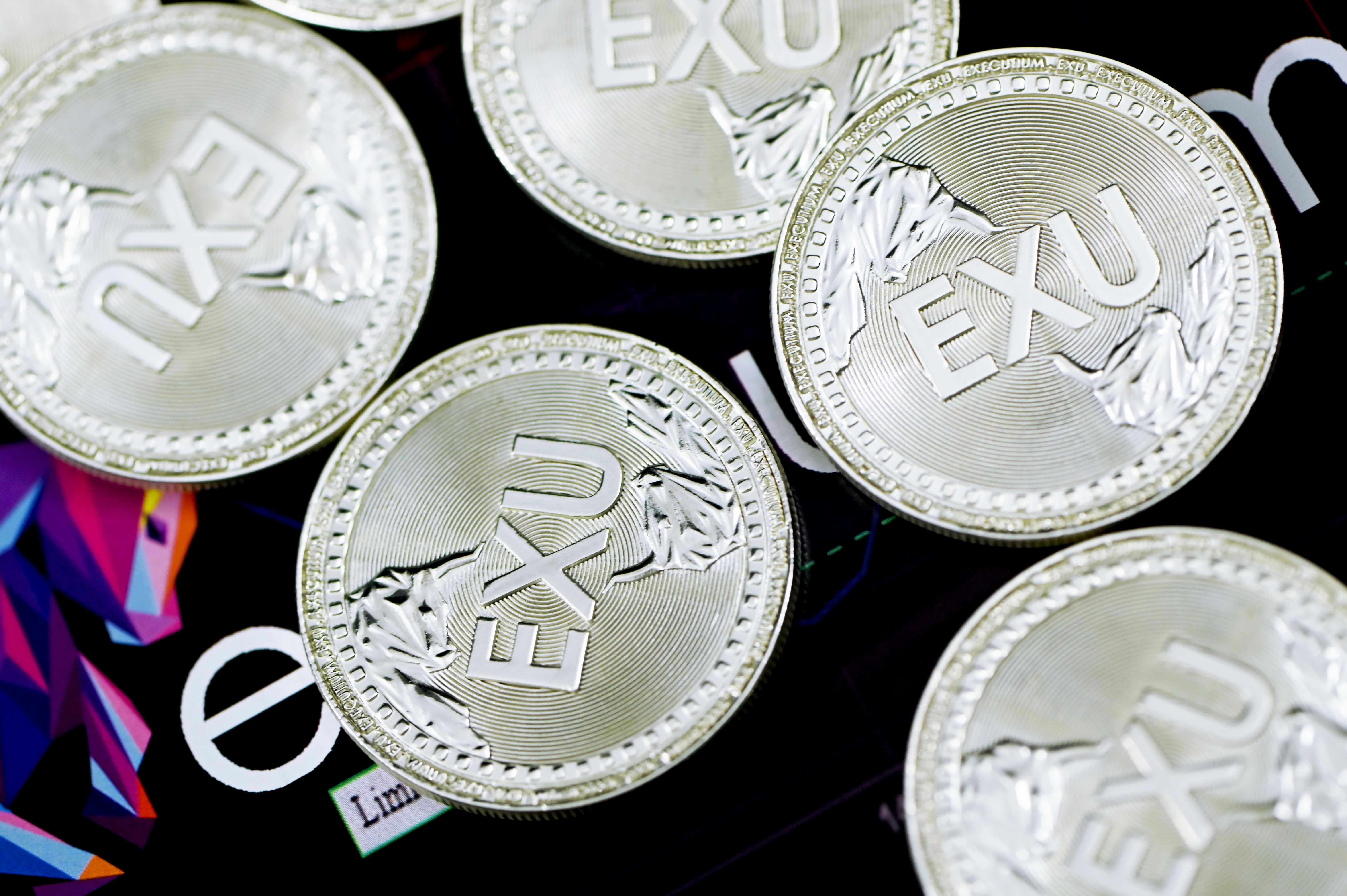 Executium coins on top of Executium board
