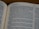 An open book displaying text in English with a focus on biblical content, including headings and body text on both visible pages.
