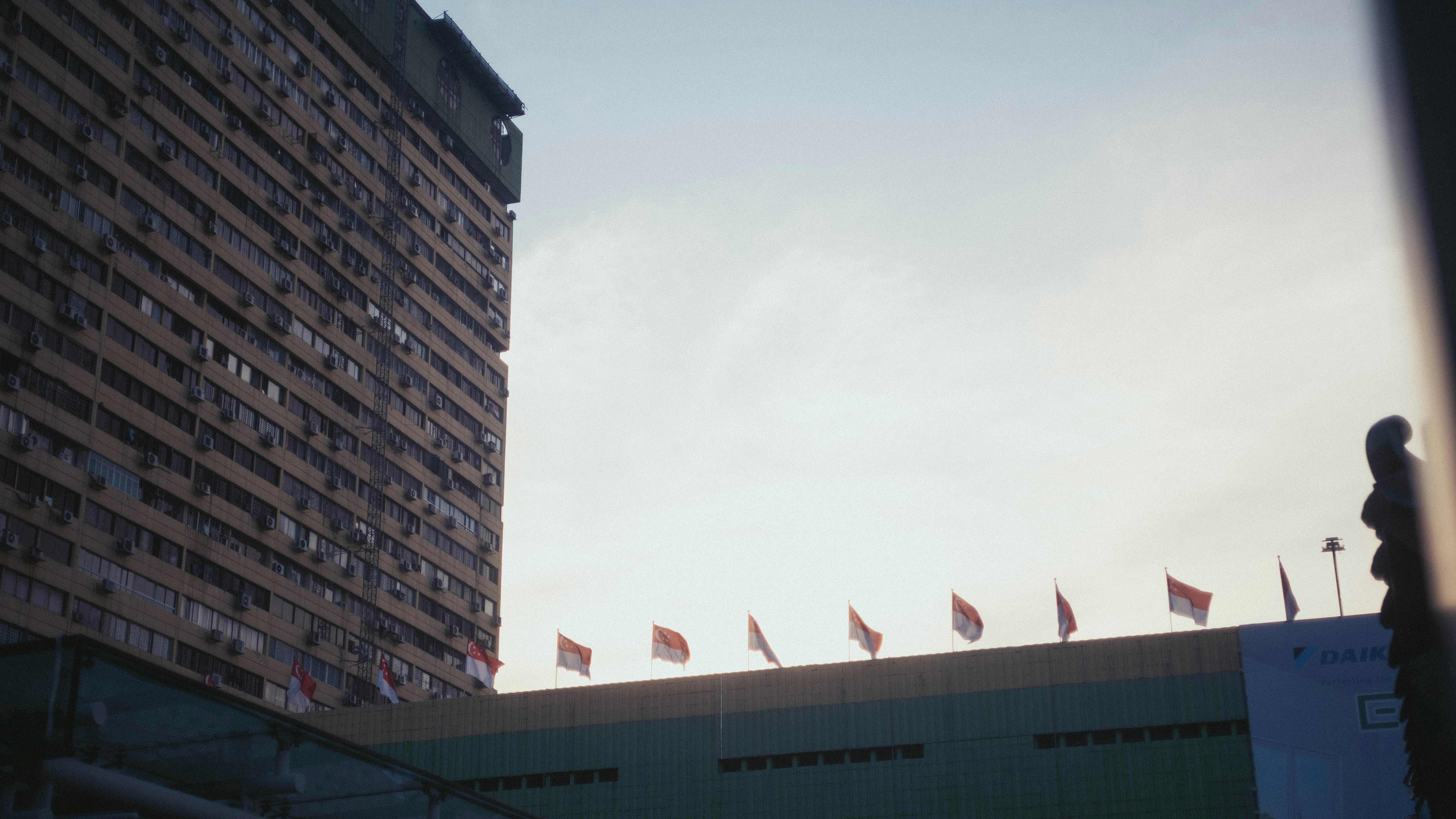 white and brown concrete building under white sky during daytime