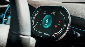 Minimalist app dashboard with light blue and red accents inspired by speedometers.