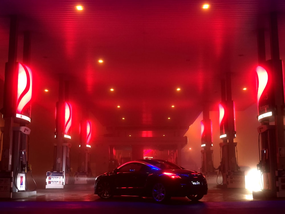 black car on road during night time