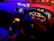 A dynamic shot of a car dashboard illuminated with carbon black and electric blue accents from logimova parts.