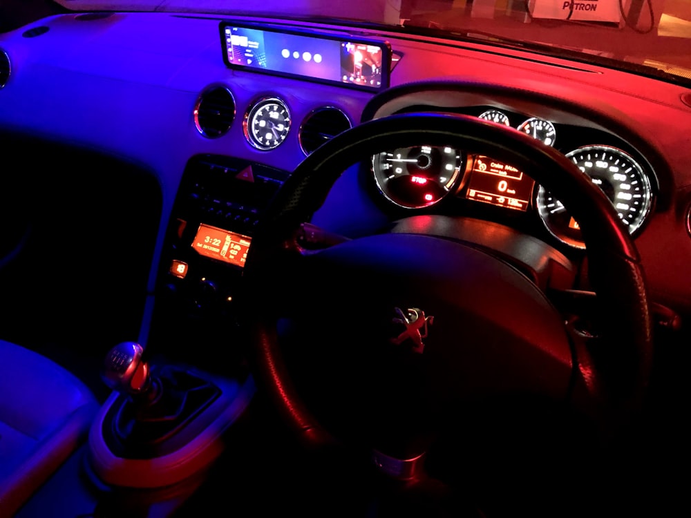 black and red car steering wheel