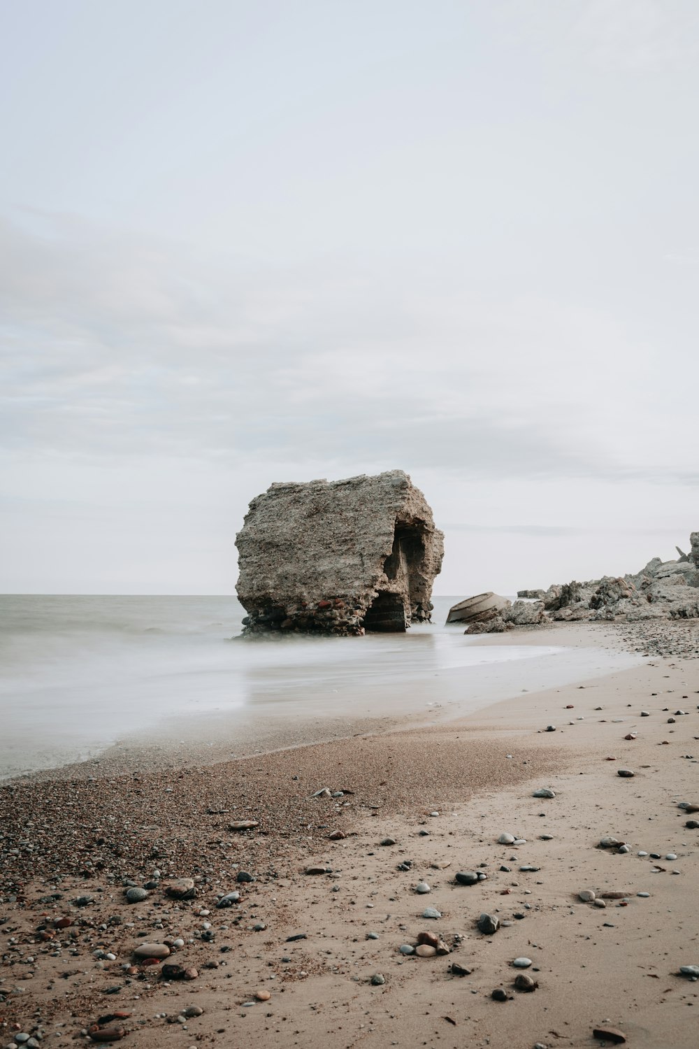 brown rock formation on sea shore during daytime