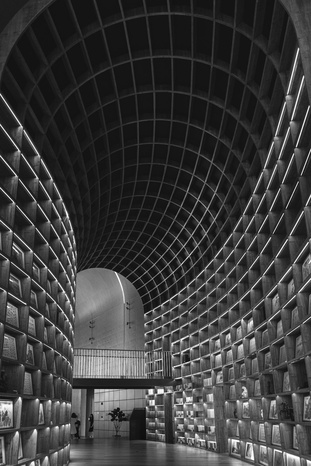 grayscale photo of tunnel with stairs