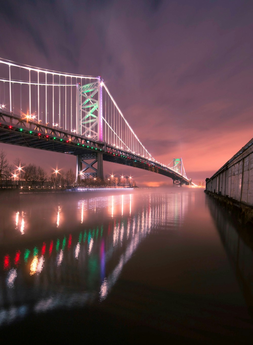 bridge over water during night time