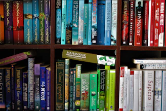 books on brown wooden shelf