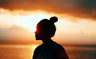 silhouette of woman during sunset